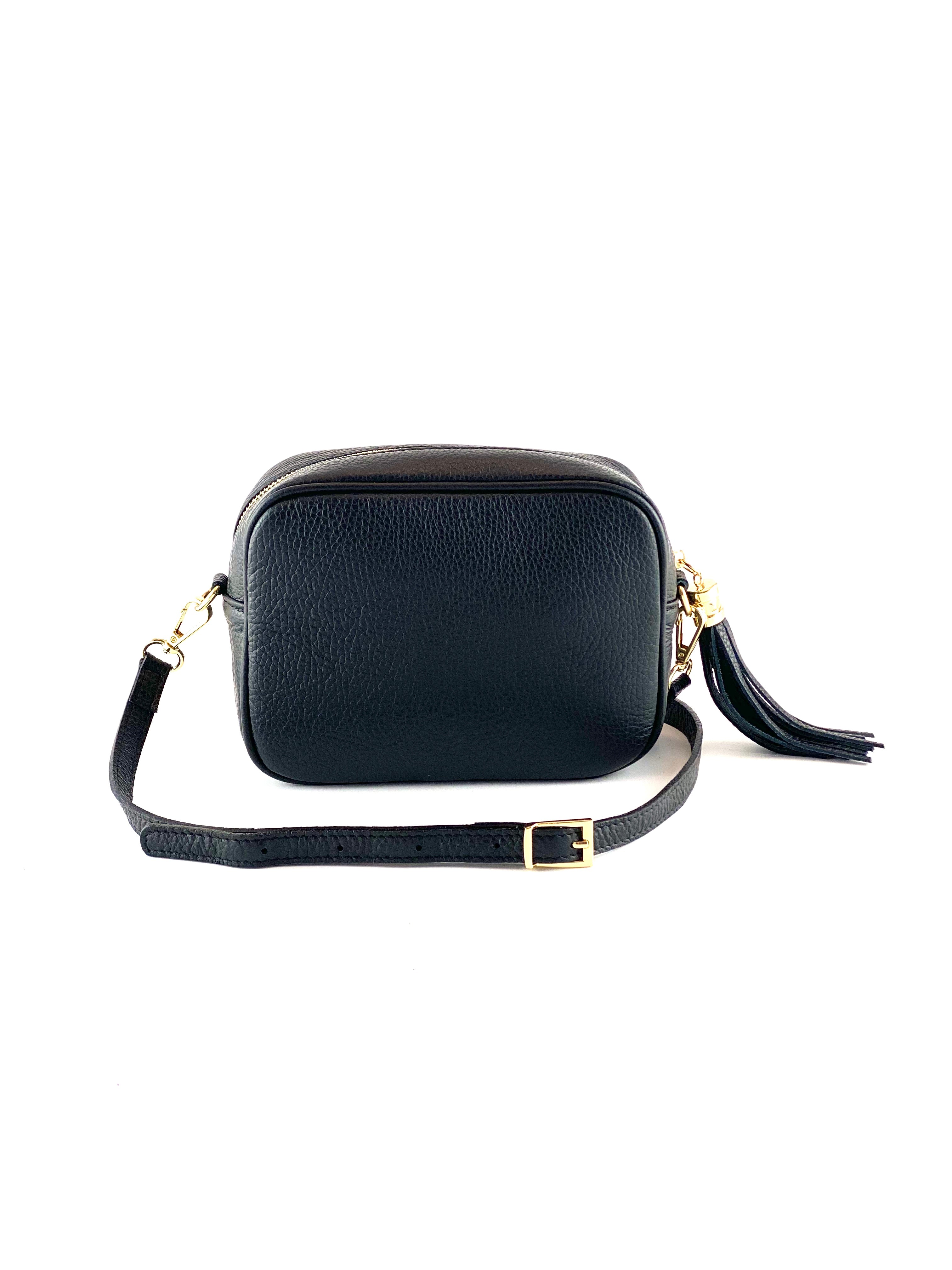 An image of a small black leather messenger bag with a leather tassel on the zip which opens across the top of the bag.