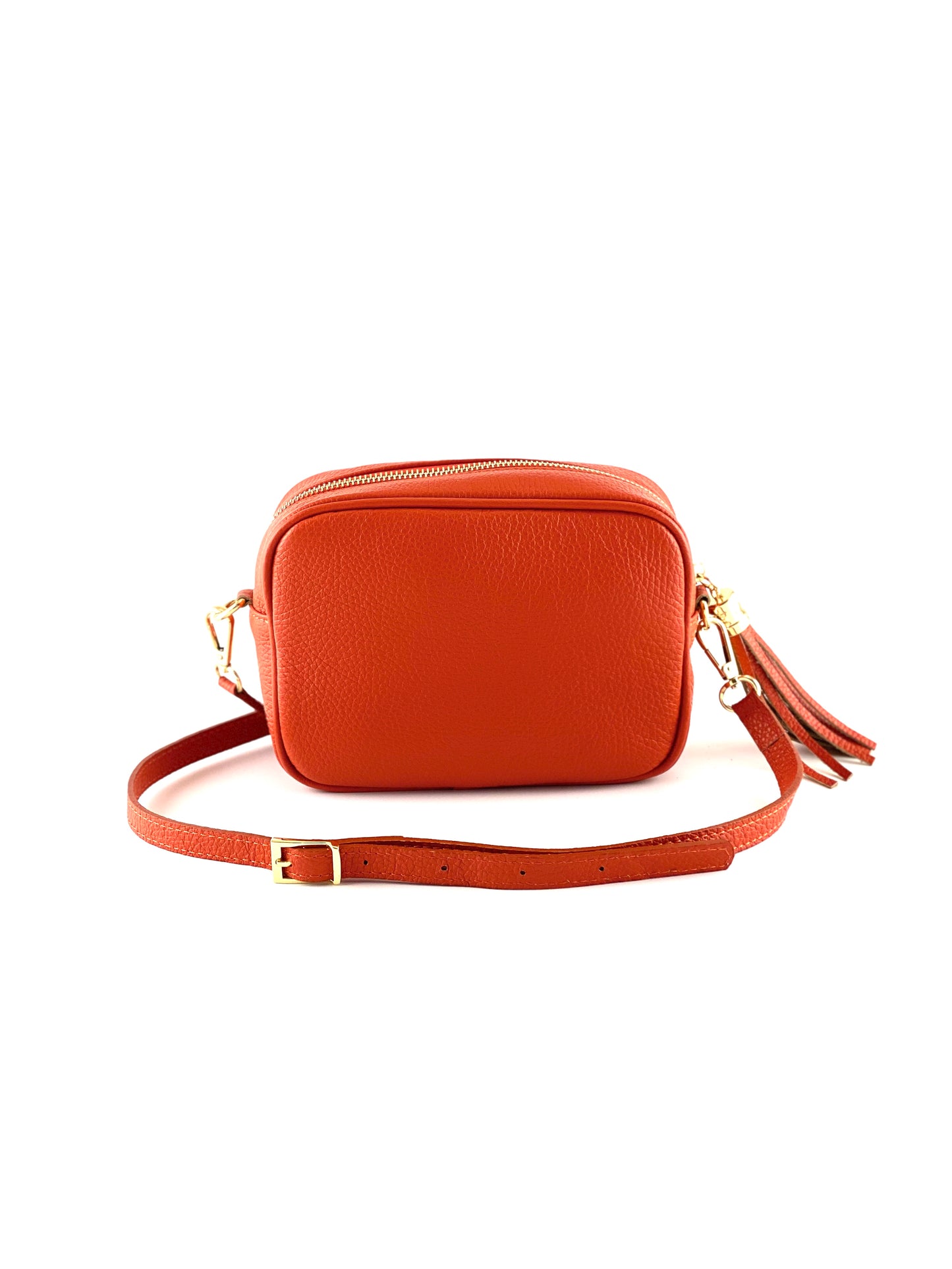 An image of a small orange leather messenger bag with a leather tassel on the zip which opens across the top of the bag.